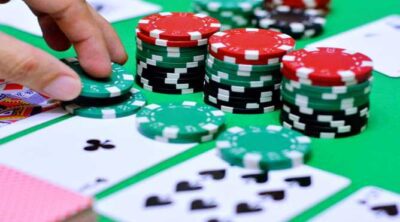 Casino chips and playing cards on a poker table
